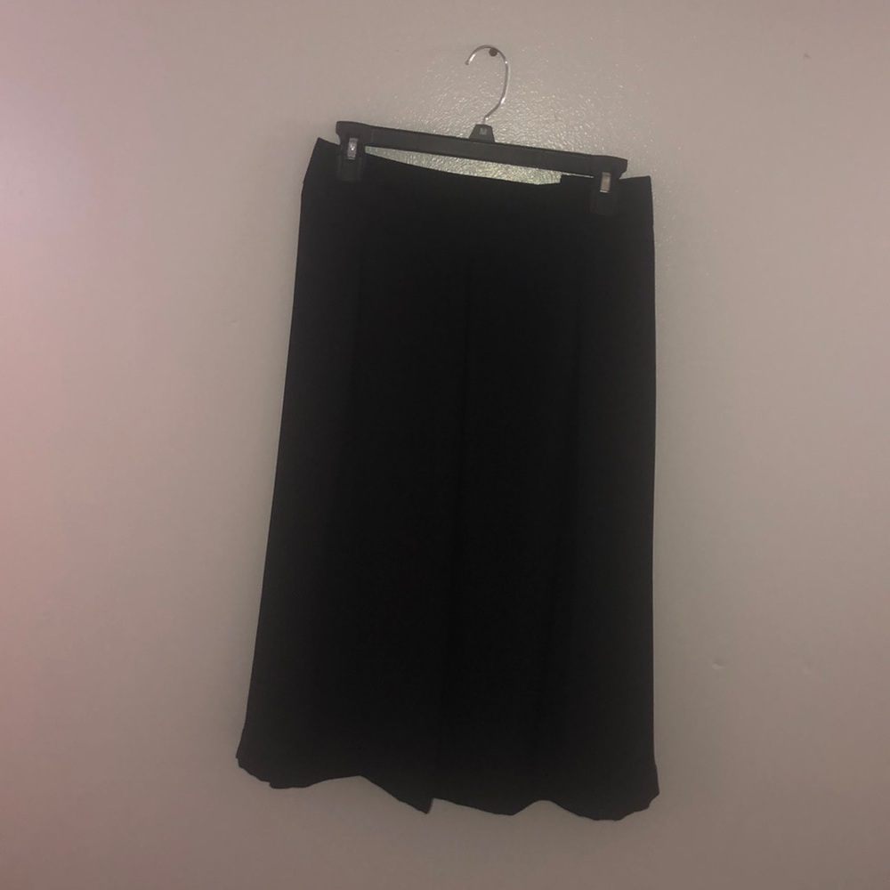 Mid length black dress skirt.